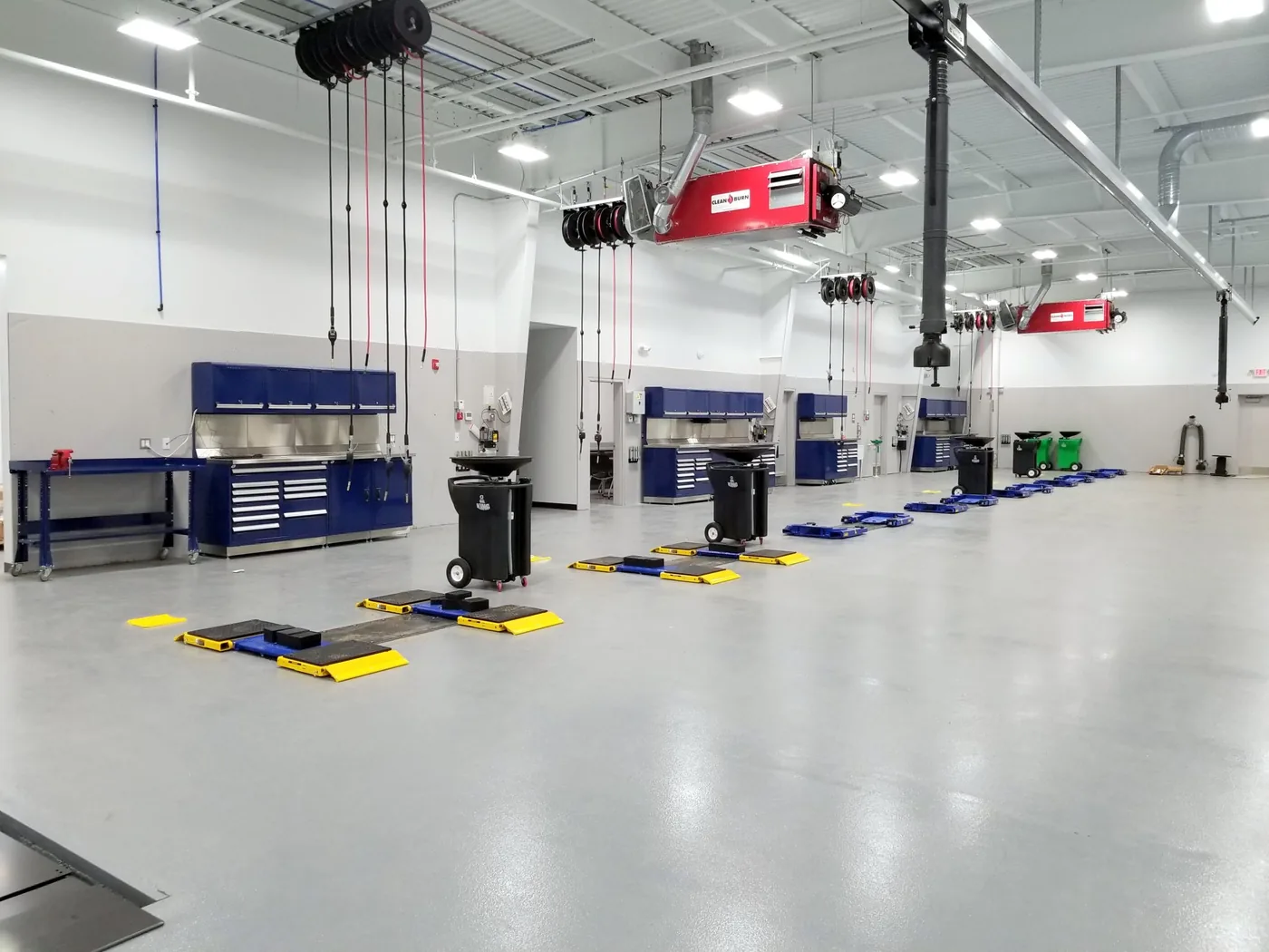 Lubrication reels and fluid dispensing equipment in a shop